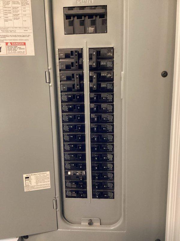 Conducted comprehensive assessment of existing electrical panel to determine compatibility for generator installation. Panel inspection revealed standard residential configuration with approximately 20 circuit breakers arranged in dual columns with main breaker at top. Customer also requested information regarding dehumidifier options for crawlspace, which was noted for inclusion in final quote.