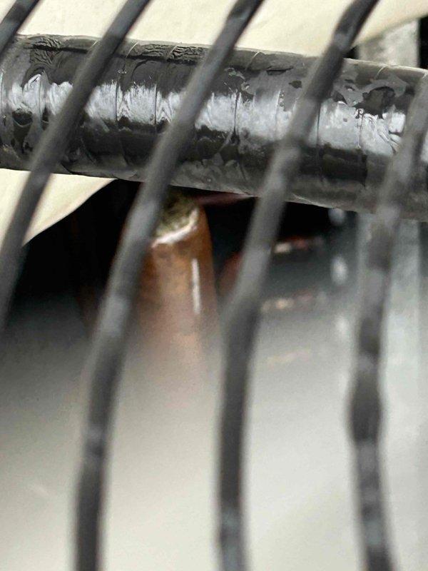 Performed annual Gold Level maintenance on 7-year-old HVAC system with CFI filter. Conducted electrical testing with clamp meter showing 6.98 amp reading. Inspected refrigerant lines and heat exchanger components, noting normal condensation on cooling coil.