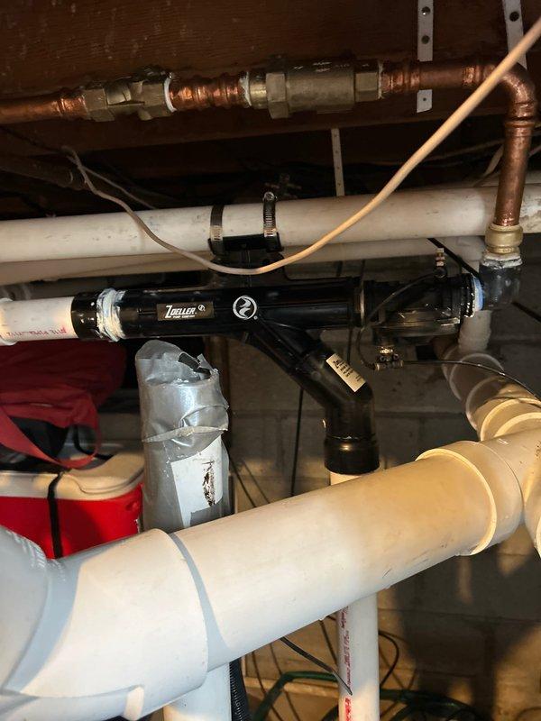 Successfully completed installation of a water-powered backup pump system in the utility area. Replaced the previous unit with a new Zoeller model, connecting it properly to the existing PVC and copper pipe network. All connections were sealed and tested to ensure proper functionality and prevent leakage.