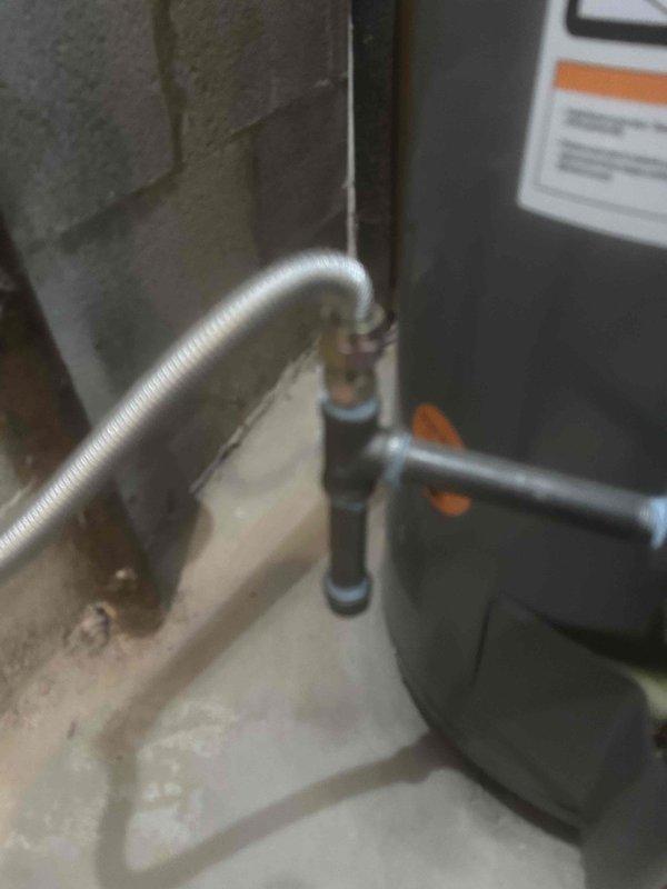 Successfully removed existing 40-gallon water heater and installed new Rheem 40-gallon unit with protective floor coverings maintained throughout service area. Installed 4" double-wall vent pipe properly routed to exterior of home, ensuring proper ventilation. All plumbing connections were secured and tested, old equipment was removed from premises, and work area was thoroughly cleaned upon completion.