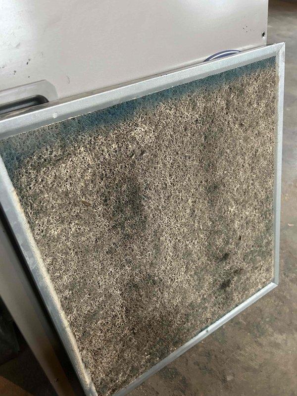 Inspected dual HVAC systems per pre-purchase inspection request. Found severely clogged air filter completely obstructed with dust and debris, significantly restricting airflow. Evaporator coil exhibited extensive contamination with accumulated particulate matter, indicating prolonged lack of maintenance. Documented condition with photos for customer review and discussed potential repair options.