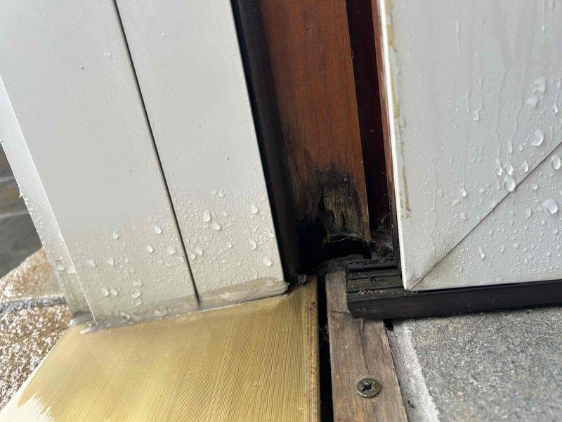 Responded to service call for water damage and leaking from attic bathroom. Discovered cast iron drain backup causing toilet leakage, resulting in ceiling and bed damage below. Shut off water supply to affected toilet and attic bathroom; documented water damage with photos. Return visit scheduled to snake the drain line, replace damaged cast iron section with PVC, and reset toilet.