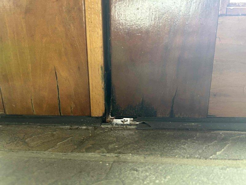 Responded to service call for water damage and leaking from attic bathroom. Discovered cast iron drain backup causing toilet leakage, resulting in ceiling and bed damage below. Shut off water supply to affected toilet and attic bathroom; documented water damage with photos. Return visit scheduled to snake the drain line, replace damaged cast iron section with PVC, and reset toilet.