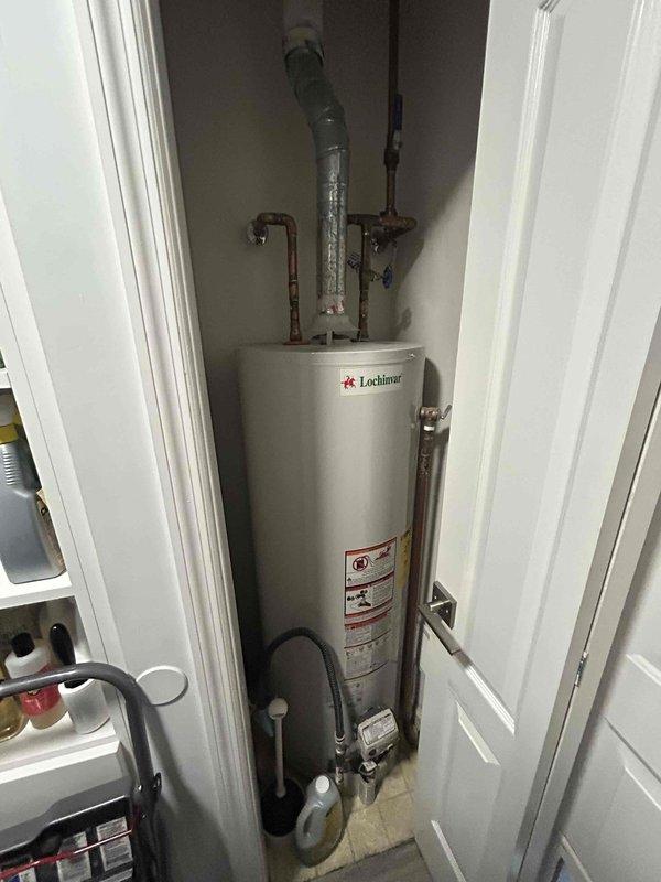 Performed annual maintenance on Daikin HVAC system located in basement. Inspected water heater (Lochinvar brand) with associated plumbing connections, ventilation duct, and valves - all components appeared to be functioning properly with normal aging but no visible damage or leaks. System was left in proper working condition.