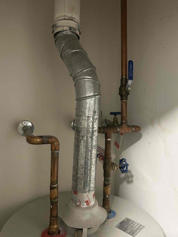 Performed annual maintenance on Daikin HVAC system located in basement. Inspected water heater (Lochinvar brand) with associated plumbing connections, ventilation duct, and valves - all components appeared to be functioning properly with normal aging but no visible damage or leaks. System was left in proper working condition.