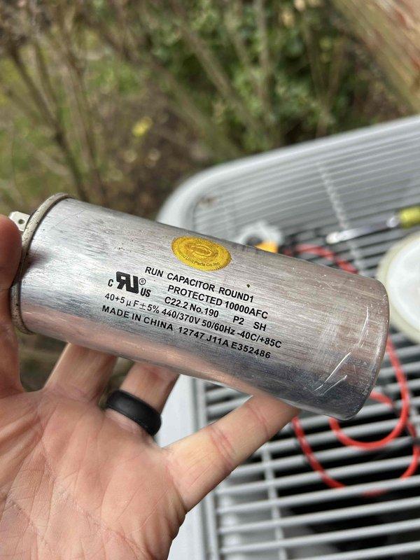 Performed Care Plan Tune-Up on dual HVAC systems in basement. Inspected and photographed run capacitor (40+5μF±5%, 440/370V) on one unit and verified proper flame pattern on gas furnace. Documented equipment information for upstairs system and confirmed proper operation of both units. Replaced media filter on system using 410 refrigerant.