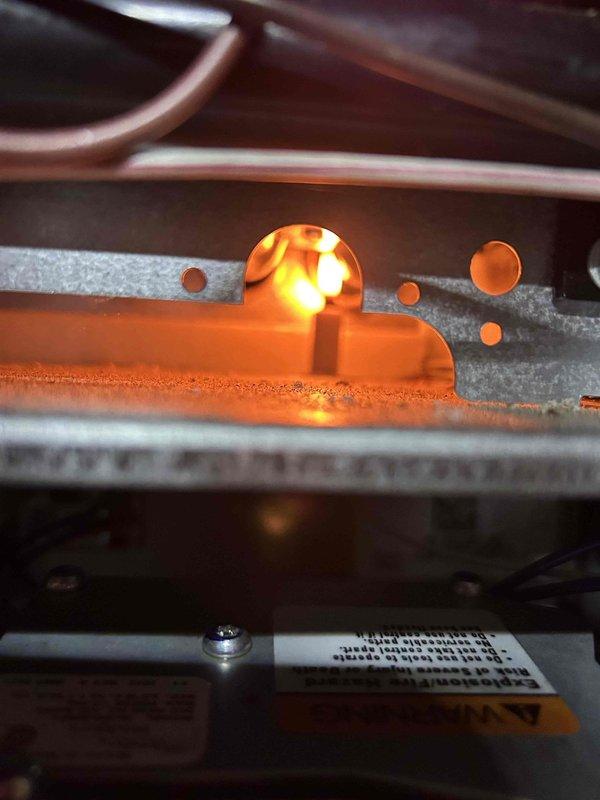 Performed Care Plan Tune-Up on dual HVAC systems in basement. Inspected and photographed run capacitor (40+5μF±5%, 440/370V) on one unit and verified proper flame pattern on gas furnace. Documented equipment information for upstairs system and confirmed proper operation of both units. Replaced media filter on system using 410 refrigerant.