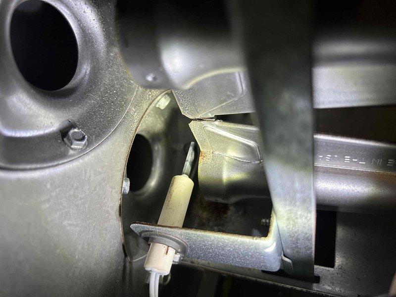 Conducted a second opinion inspection on a furnace with a reported cracked heat exchanger. Upon thorough examination of the heat exchanger and combustion chamber, no evidence of cracks or failure was found. Also noted proper installation of the water heater ventilation system with all connections secure and functioning correctly.