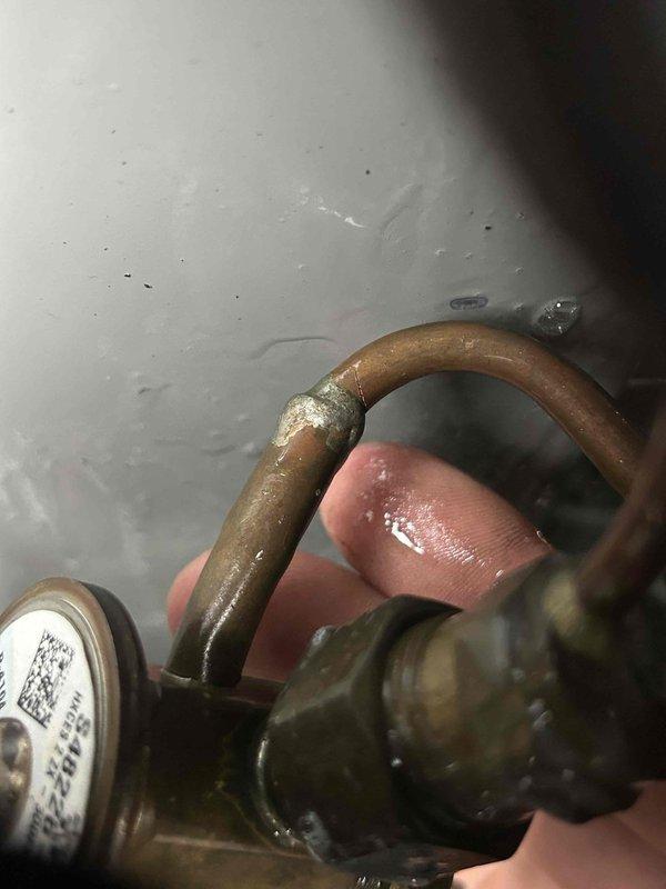 Diagnosed 3-year-old AC system with no cooling issue traced to significant corrosion at refrigerant line connections, causing refrigerant leakage and preventing proper system operation. Repaired corroded copper pipe joints, recharged system with appropriate refrigerant, and restored cooling functionality. Additionally, repaired collapsed ductwork under house to ensure proper airflow throughout the system.