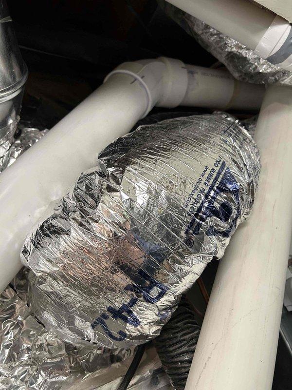 Relocated supply run in main floor to accommodate new wall framing, cutting access point in subfloor and rerouting ductwork with proper connections and insulation to maintain system integrity and airflow.