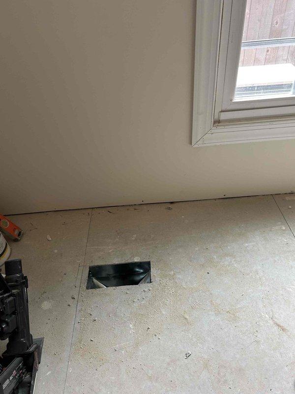 Relocated supply run in main floor to accommodate new wall framing, cutting access point in subfloor and rerouting ductwork with proper connections and insulation to maintain system integrity and airflow.