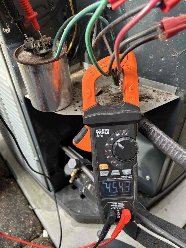 Performed Care Plan Tune-Up on dual AC/Gas Furnace units located in upstairs closet. Conducted electrical diagnostics using clamp meter, measuring 45.43A current draw, and inspected capacitor connections with multiple wires (orange, purple, brown, and red) showing normal wear and dust accumulation. Verified proper electrical functioning of both systems and confirmed filter sizes (16x20x1, 20x20x1) for future maintenance.
