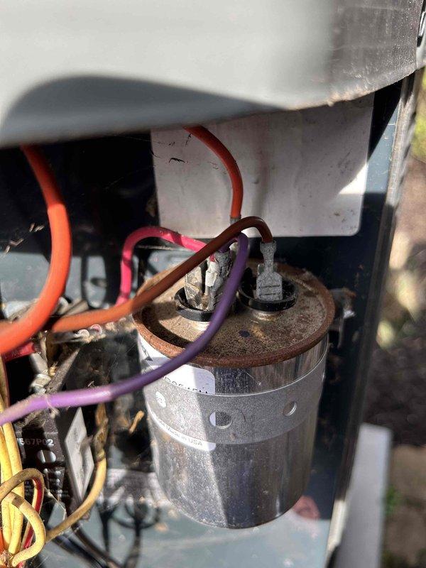 Performed Care Plan Tune-Up on dual AC/Gas Furnace units located in upstairs closet. Conducted electrical diagnostics using clamp meter, measuring 45.43A current draw, and inspected capacitor connections with multiple wires (orange, purple, brown, and red) showing normal wear and dust accumulation. Verified proper electrical functioning of both systems and confirmed filter sizes (16x20x1, 20x20x1) for future maintenance.