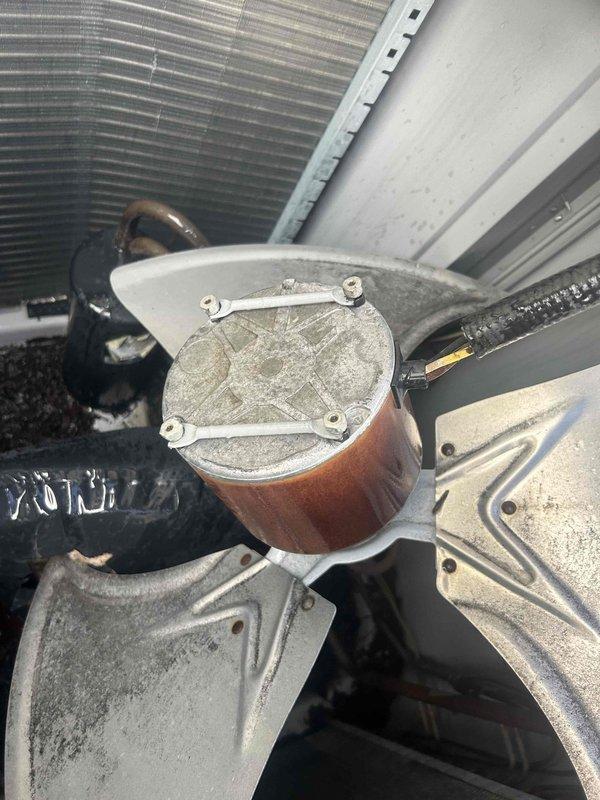 Responded to service call for AC unit with damaged fan and refrigerant leak. Upon inspection, found fan blade had broken off and impacted refrigerant line, causing system leak. Replaced damaged fan assembly and repaired refrigerant line, then recharged system to manufacturer specifications after verifying no additional leaks were present.
