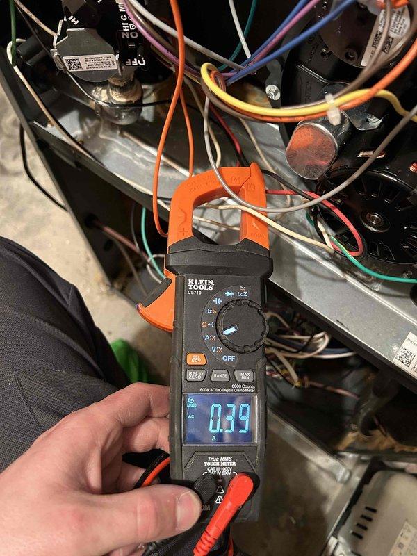 Completed Care Plan Tune Up on two air conditioners and two gas furnaces located in attic and basement. Performed comprehensive electrical testing using Klein Tools clamp meter, verifying proper amperage readings (0.39A and 1.95A) on system components. Customer-supplied filters were installed during maintenance.