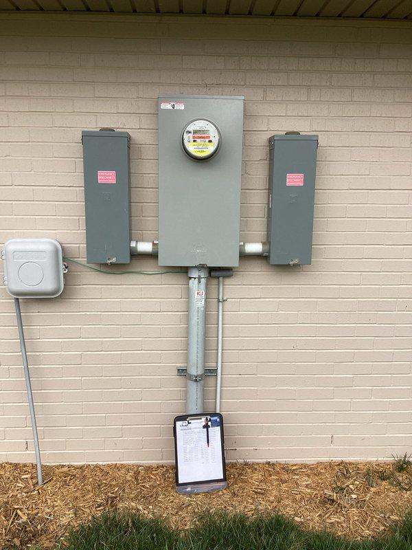 Conducted site assessment for generator installation, inspecting crawlspace access point for potential wiring pathways and evaluating existing electrical service panel configuration. Documented current meter setup and adjacent junction boxes to determine appropriate connection points and load capacity for proposed generator system.