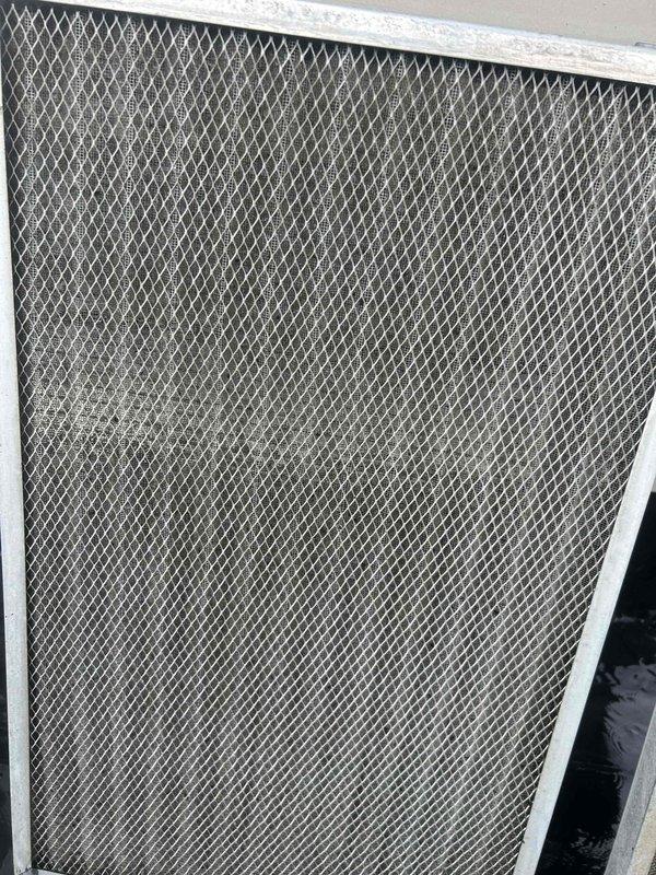 Performed scheduled maintenance service on 23 rooftop units as part of quarterly PSAC agreement. Replaced filters according to specifications and documented corroded shaft/pulley assembly requiring attention. Photographic documentation taken of deteriorated mechanical components and filter condition for service records.