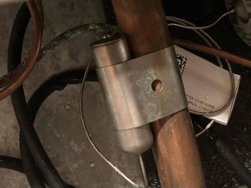 Performed Gold Level prepaid maintenance service on dual heat pump system. Tested electrical components using Fluke 376 FC clamp meter with readings at 4.9 amps, and inspected copper line connections at both air handlers for proper installation and condition. All systems functioning within normal parameters.