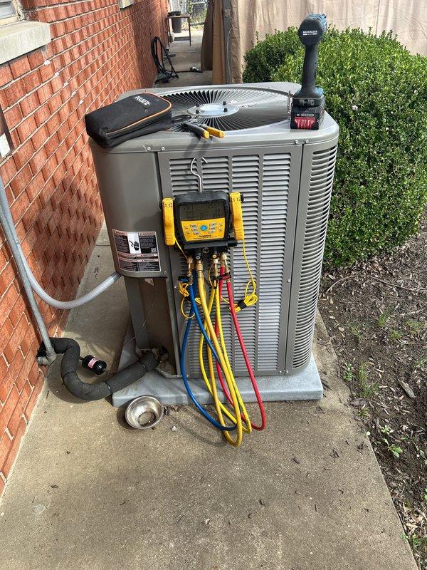 Performed scheduled care plan tune-up on heat pump system with air handler located in basement. Conducted electrical diagnostics using a clamp meter to verify proper amperage draw on the system. Connected manifold gauges to outdoor unit to check refrigerant pressures and system operation parameters, confirming all readings within manufacturer specifications.