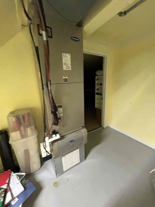 Completed scheduled Care Plan Tune Up on Carrier heat pump/air handler system located in basement. Inspected electrical connections and components, checking wiring and circuit board for proper operation. System is functioning normally with all components in working order.