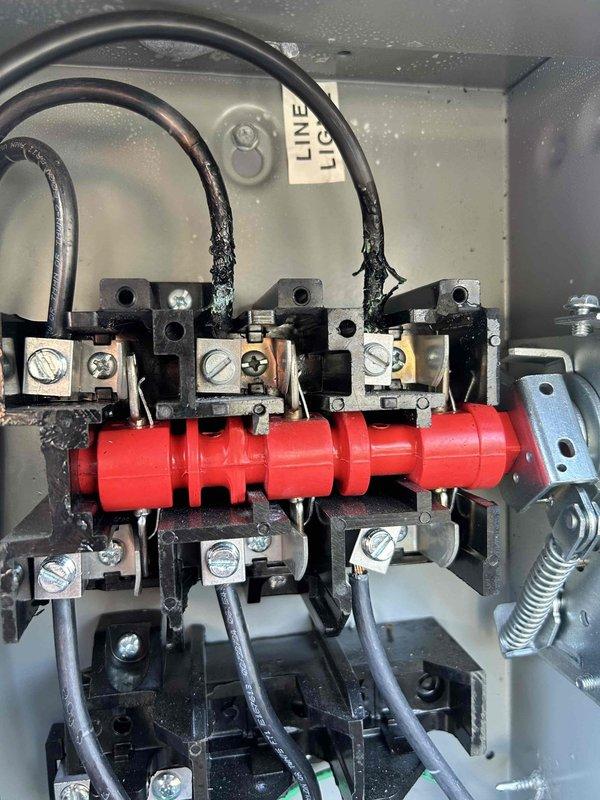 Responded to service call regarding non-functional thermostat on 2nd rooftop unit. Inspection revealed severe electrical damage with burned and frayed wires connected to the terminal bus bar inside the control panel. Observed condensation/moisture throughout the electrical enclosure which likely contributed to the failure. Replaced damaged wiring and terminal connections, then sealed panel properly to prevent future moisture infiltration.