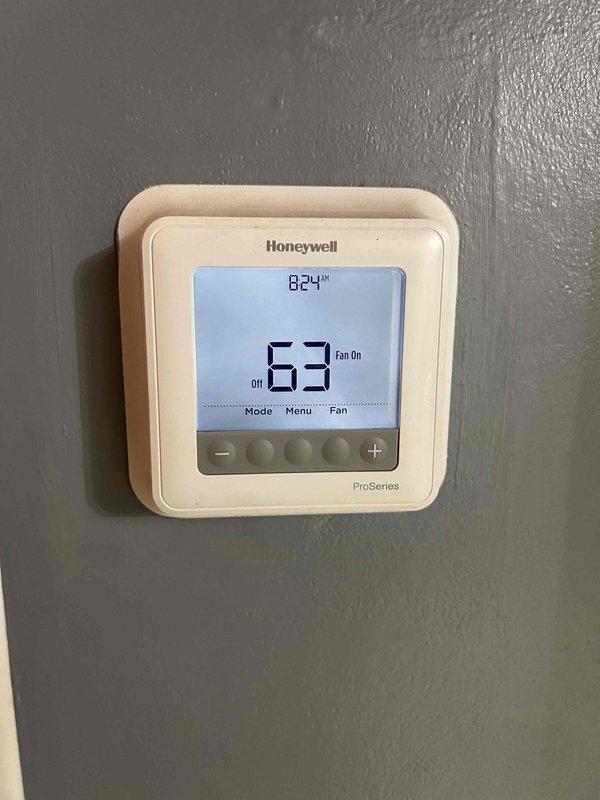 Responded to service call for 6-year-old electric HVAC system not cooling properly. Diagnosed issue with outdoor unit failing to activate while indoor unit continued to circulate room temperature air. Inspection of the electrical panel and Honeywell ProSeries thermostat confirmed proper power supply and thermostat functionality. Resolved cooling issue and restored system to normal operation.