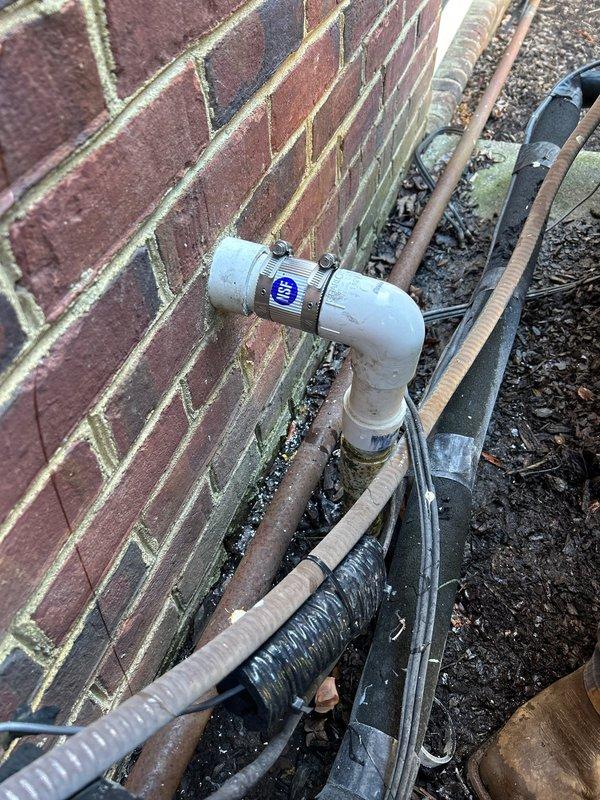Repaired exterior hose bibb on brick wall, replacing damaged components and ensuring proper function. Fixed broken PVC pipe near AC unit by installing new coupling and securing connection. Customer opted to perform water heater flush independently.