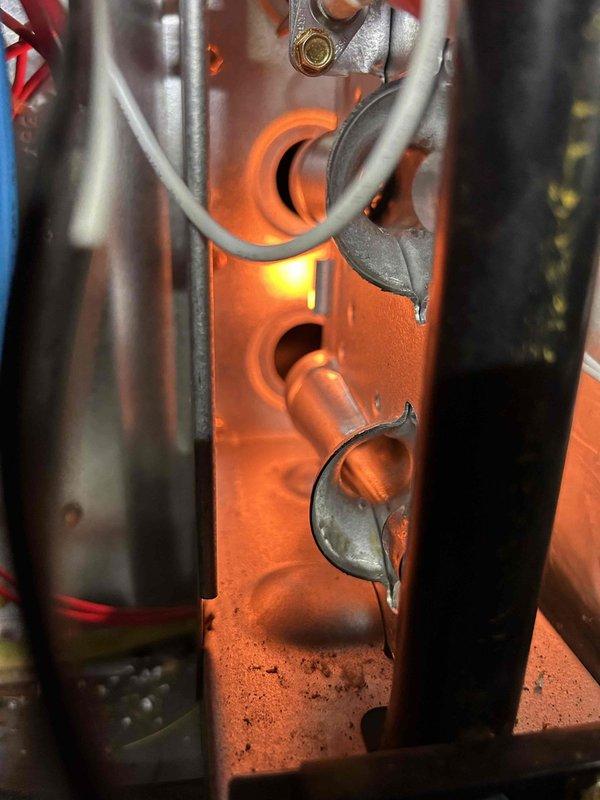 Performed annual tune-up on gas furnace located in crawlspace. Inspected burner assembly and heat exchanger, confirming proper combustion with normal blue flame pattern. Checked all electrical connections and components for proper operation. Customer's 12x30x1 filter in floor return was in acceptable condition.