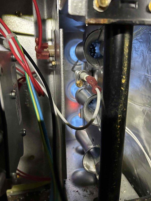 Performed annual tune-up on gas furnace located in crawlspace. Inspected burner assembly and heat exchanger, confirming proper combustion with normal blue flame pattern. Checked all electrical connections and components for proper operation. Customer's 12x30x1 filter in floor return was in acceptable condition.