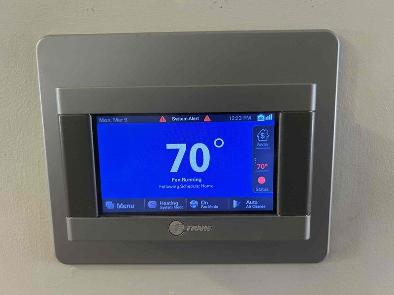 Diagnosed and serviced 6-year-old Trane heat pump system that was not providing cooling. Found error codes 184.07 and 8 on thermostat display, indicating communication failure. Determined control module requires replacement, scheduled for 2025 maintenance cycle. Performed system verification and documented current condition with photos of thermostat and air handler installation.