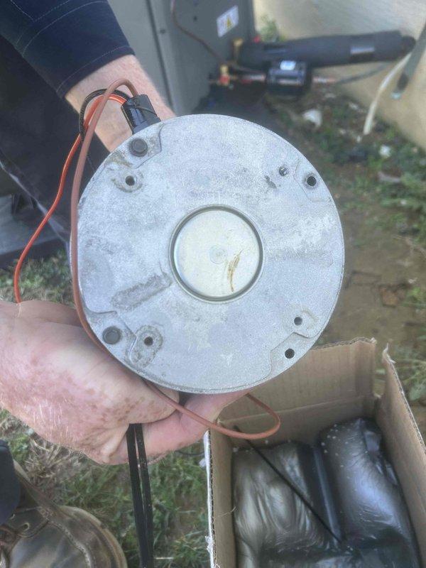 Replaced warranty condenser fan motor in outdoor HVAC unit after confirming part availability at 2J supply house. Removed failed motor showing signs of corrosion, installed new unit with proper electrical connections, and returned defective part to supplier with appropriate warranty documentation.