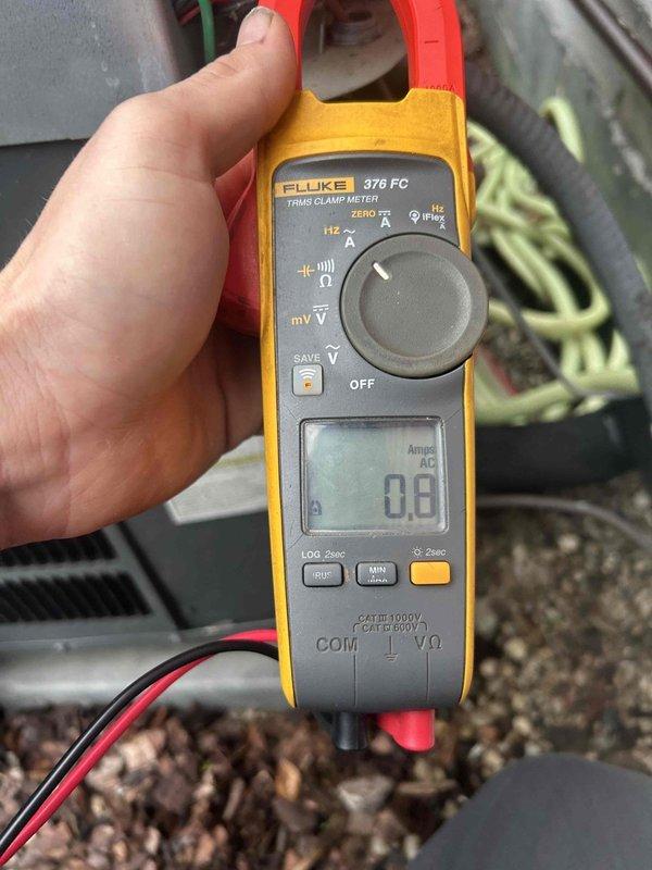 Performed scheduled maintenance tune-up on GF system with attic-mounted AC equipment per Care Plan. Inspected ductwork connections, noting significant dust accumulation and potential insulation deterioration at pipe joints. Conducted electrical diagnostics using Fluke 376 FC clamp meter to verify proper amperage readings. Customer's filter was replaced as part of service.