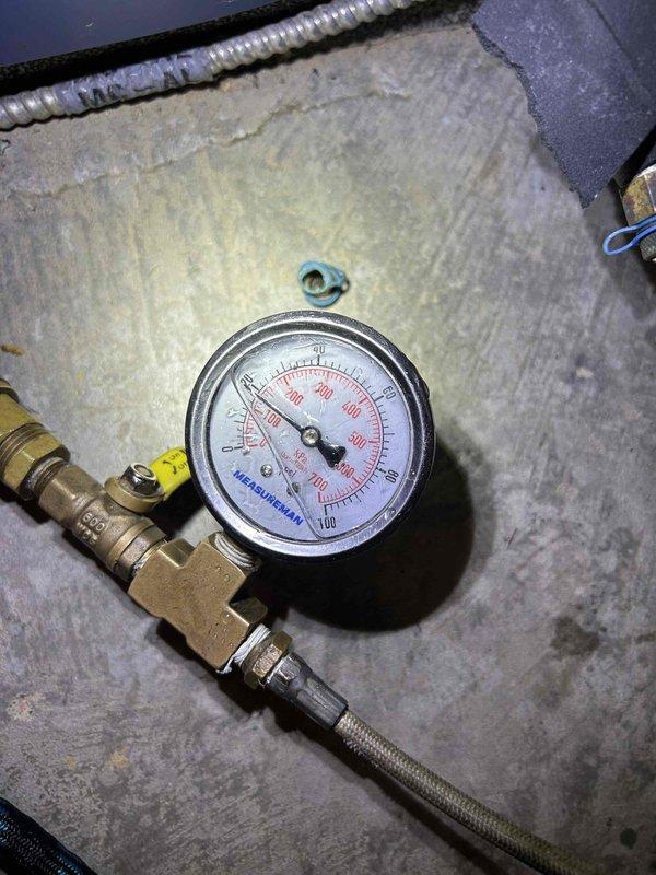 Performed annual maintenance on wall-mounted GEOLINK ground loop geothermal system located in basement. Inspected circulation pumps and verified proper operation. Checked system pressure gauge, confirming readings within manufacturer specifications. Customer supplied 30x36x2 filter which was installed during service.
