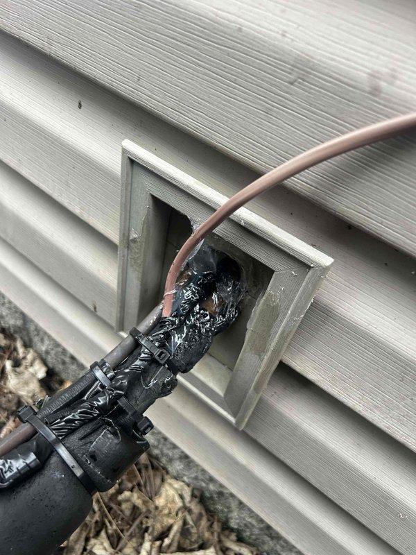 Inspected home's HVAC exterior line set and electrical connections at the utility chase where wires enter the structure. Secured loose wiring with new zip ties and applied proper weatherproofing to prevent animal intrusion and potential wire damage. Ensured all connections were properly sealed and protected against environmental exposure.