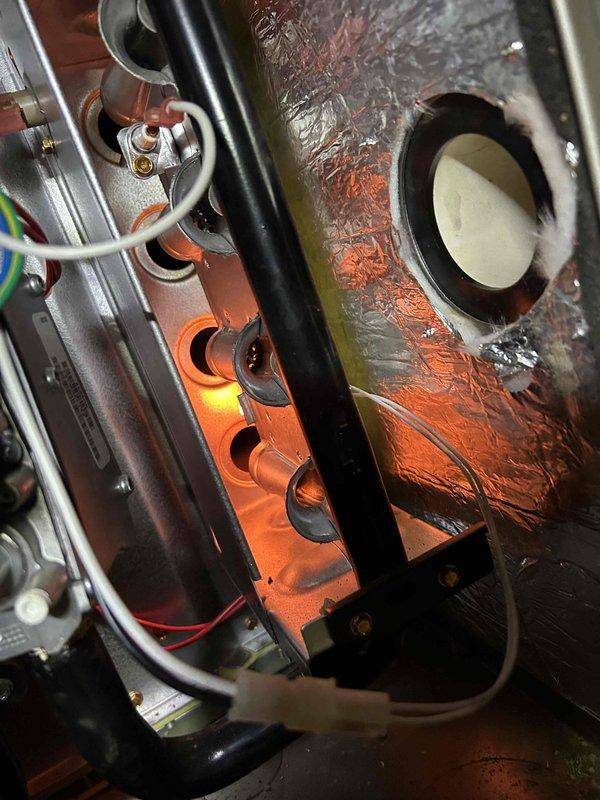 Completed Care Plan Tune Up on AC and gas furnace located in crawl space #413. Performed electrical testing with multimeter showing 12.42A/0.3V readings and inspected furnace burner assembly, verifying proper ignition and flame pattern. Recommended replacement of filter as it was not included in service.