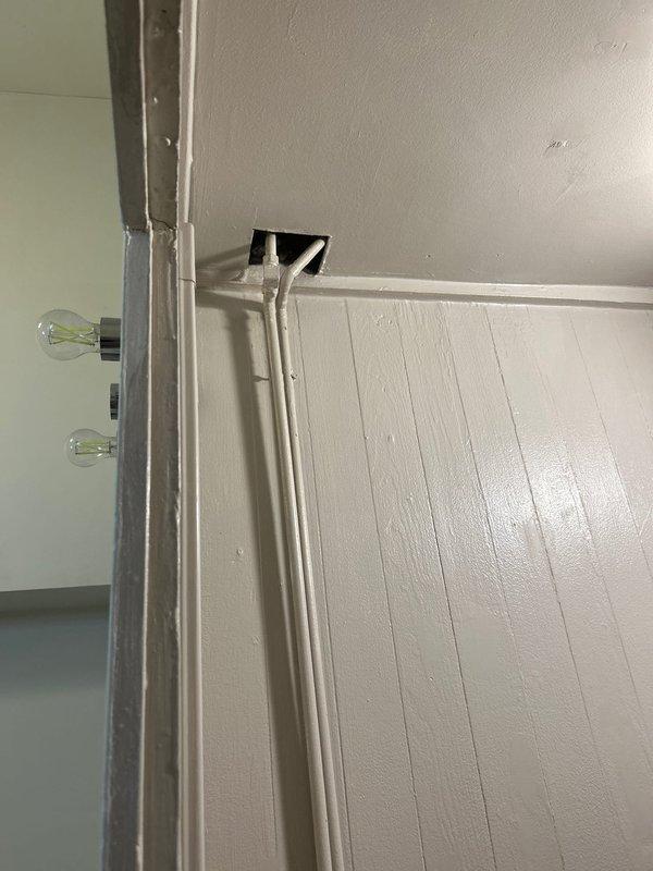 Completed plumbing repair as requested, with additional work performed as authorized by customer. Inspected wall area near electrical conduit and baseboard vent, addressing plumbing issues in that section. Modified scope of work based on assessment of required repairs.