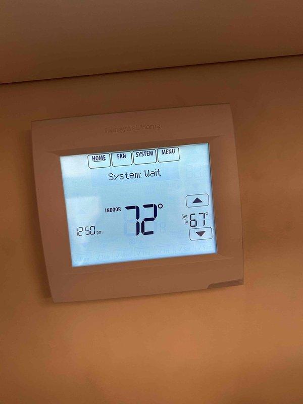 Responded to no-cool complaint on a relatively new electric system (under 3 years old) where customer reported unit unable to cool below 75°F for approximately two days. Diagnostic testing revealed supply air temperature of 50.3°F measured with PDT650 thermometer, indicating proper cooling function. Thermostat inspection showed system in "wait" mode with indoor temperature at 72°F while set to 67°F. System is functioning properly with normal temperature differential; educated customer on system operation and capabilities.