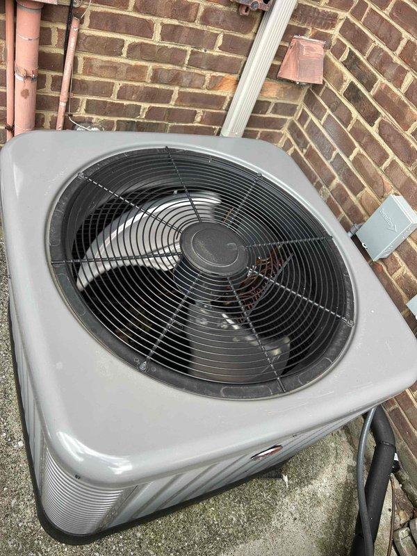 Performed routine maintenance on basement AC/GF unit. Inspected Aprilaire 410 humidifier as customer reported operational issues. Conducted temperature measurements and verified proper function of outdoor condenser unit located against brick exterior wall.
