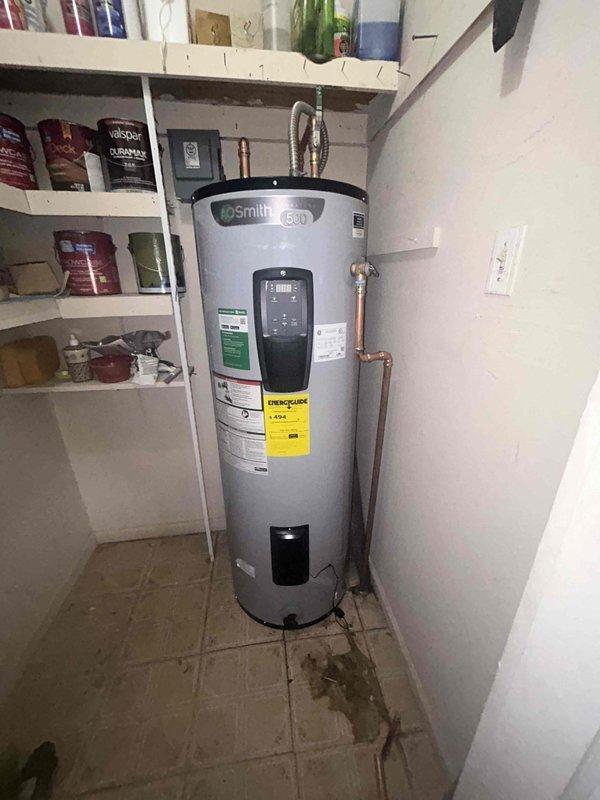 Successfully removed existing galvanized line underneath bathroom faucet and installed new shut-off valve, ensuring proper functionality. Installed customer-supplied Smith 530 water heater with digital control panel, connecting all necessary copper piping and completing electrical connections in the utility area.