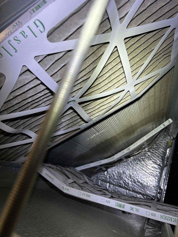 Inspected commercial system reported as not cooling properly in office and sanctuary areas. Found system in OFF mode with thermostat reading 63°F indoor temperature. Examined air filtration system which appeared to be in acceptable condition from previous maintenance visit. Restored proper system operation by correcting thermostat settings and verifying cooling function.