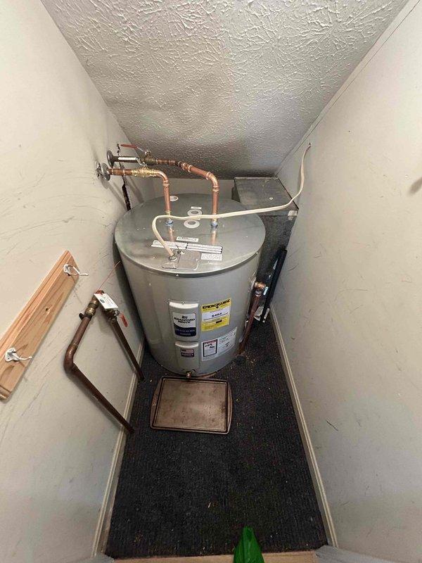 Successfully completed installation of Bradford White gas water heater, including proper drainage and removal of old unit. Hard-piped water lines with copper connections, replacing previous flexible hoses for improved durability. Performed comprehensive leak check, verified proper water heater operation, and conducted water quality testing to ensure system integrity.