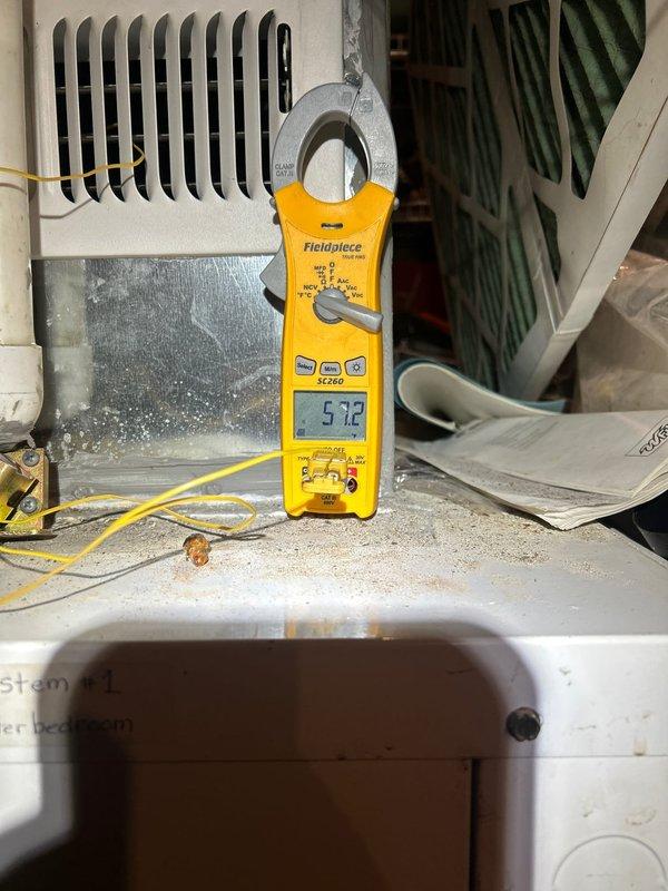 Upon arrival, diagnosed dual HVAC systems (one in attic, one in basement) experiencing cooling failure. Performed electrical diagnostics with Fieldpiece meter, detecting abnormal amperage readings of 5.72. Inspected and serviced geothermal system components including insulated plumbing connections to storage tank. Both systems restored to proper cooling operation.