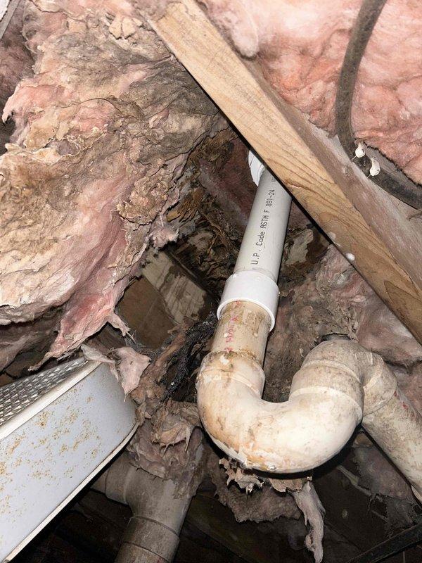 Staged materials in warehouse for upcoming faucet repair. Inspected existing P-trap installation with surrounding insulation and examined chrome bathtub valve handle and spout. Will return to complete repairs as scheduled, requiring approximately 2 men/4 hours of labor.