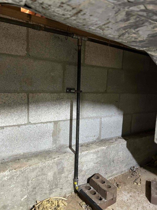 Completed dual fuel HVAC system installation and returned to install outdoor temperature sensor for proper system operation. Verified proper installation of ductwork and piping in basement area. All components secured and operational.