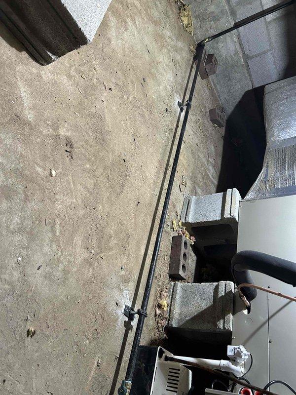 Completed dual fuel HVAC system installation and returned to install outdoor temperature sensor for proper system operation. Verified proper installation of ductwork and piping in basement area. All components secured and operational.