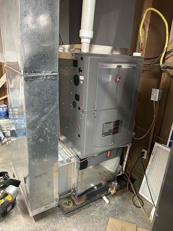 Responded to no-heat service call for a Rheem electric furnace less than 10 years old. Diagnostic testing revealed the main limit switch was open (error code A022_F), preventing proper heating. Reset the limit switch, cleaned accumulated dust around components, and verified proper system operation with normal airflow and heating restored.