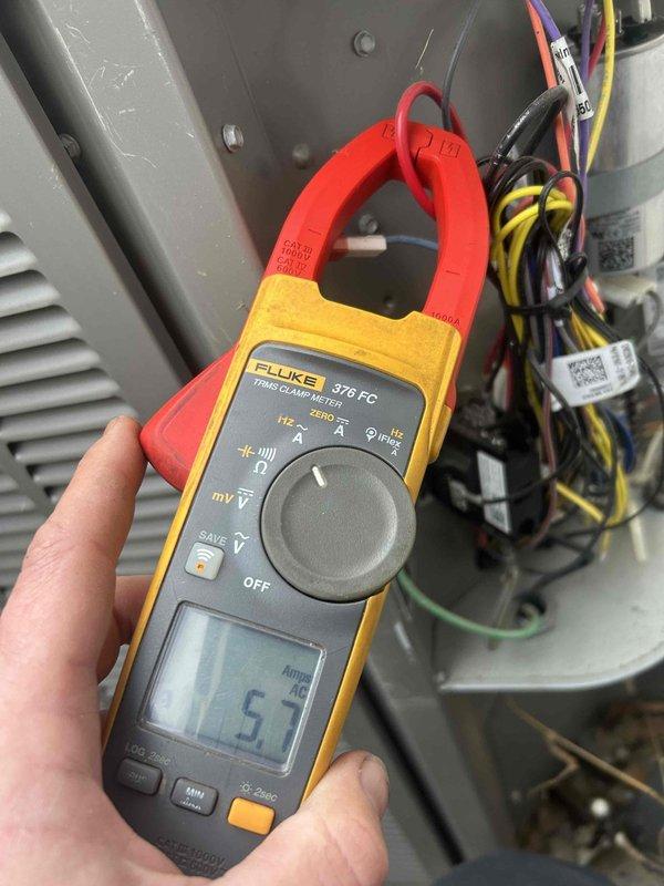 Performed Care Plan maintenance service on a 6-system commercial installation, conducting electrical diagnostics with readings of 5.7A verified with Fluke 376 FC meter. Inspected exterior conduit connections and electrical junction boxes for proper installation and weatherproofing. Noted presence of customer-owned R22 refrigerant tank available for recharging older systems as needed. Replaced required filters per specifications: (1) 18x20x1, (1) 20x20x1, (2) 20x25x1, and (2) 16x25x1.