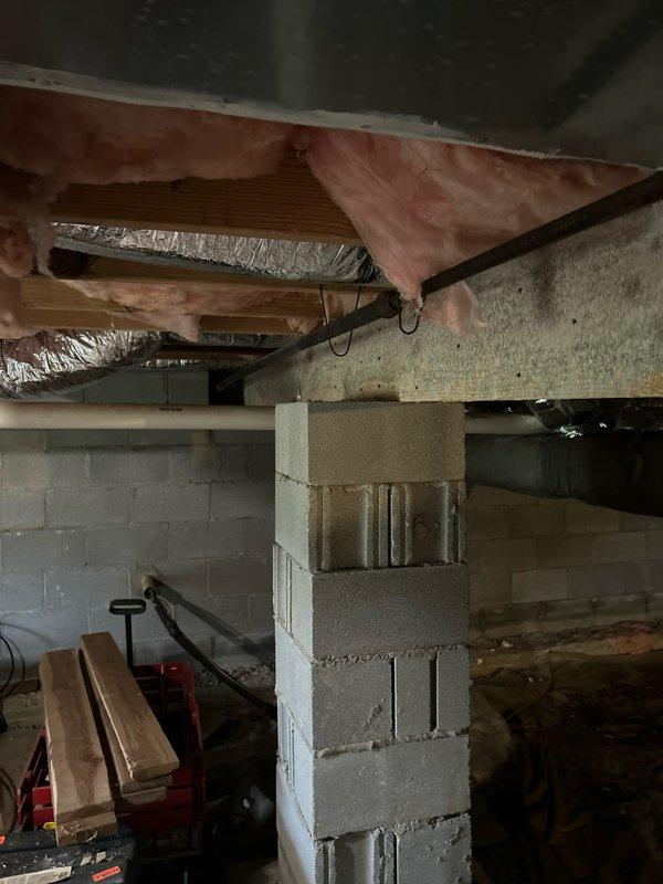 Conducted assessment for additional water heater installation to supplement existing unit that is insufficient for customer's 80-gallon therapeutic tub. Inspection of basement/crawlspace revealed copper supply lines and adequate space for installation. Documented current plumbing configuration and structural elements to determine optimal placement for secondary water heater that will provide adequate hot water capacity for the therapeutic tub requirements.