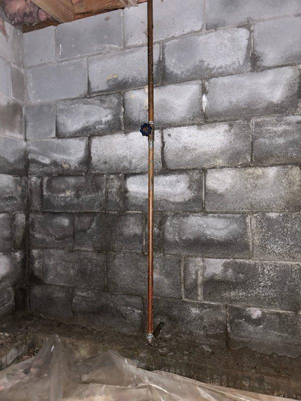 Conducted assessment for additional water heater installation to supplement existing unit that is insufficient for customer's 80-gallon therapeutic tub. Inspection of basement/crawlspace revealed copper supply lines and adequate space for installation. Documented current plumbing configuration and structural elements to determine optimal placement for secondary water heater that will provide adequate hot water capacity for the therapeutic tub requirements.