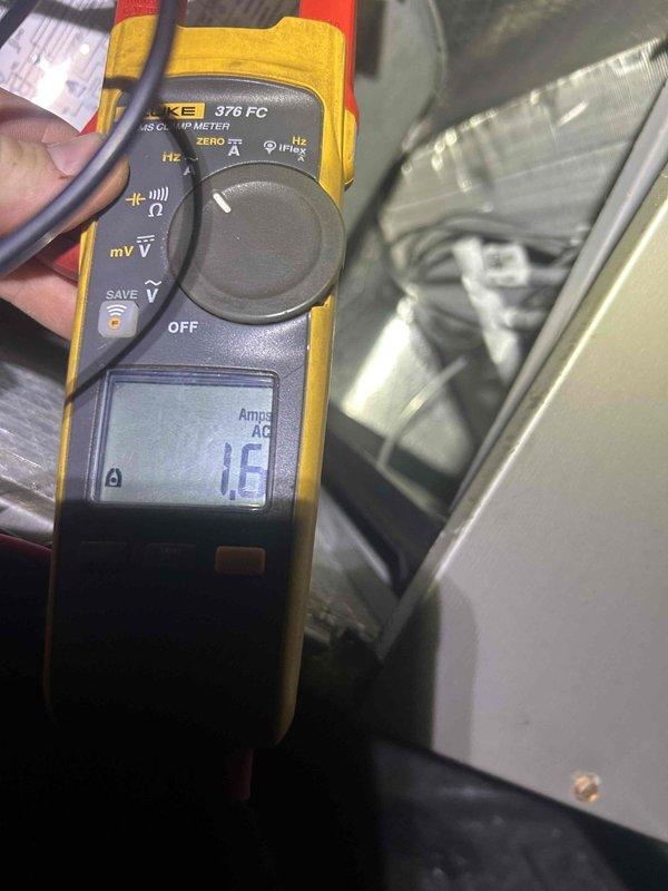 Performed commercial HVAC planned service maintenance on unit requiring 8' ladder access for indoor components above drop ceiling and ground-level access for outdoor components. Inspected ventilation ductwork and damper assembly, and measured electrical current draw of 1.6 Amperes AC using Fluke 376 FC clamp meter. Replaced 21.5" x 13" x 1" air filter as part of routine A/C tune-up service.